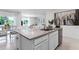 Kitchen island featuring stainless steel dishwasher and sink overlooking living and dining areas at 1074 Clay Blvd, Tavares, FL 32778