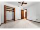 Bedroom with carpet flooring, ceiling fan, closet space and paneled doors at 109 Crestwood Dr, Longwood, FL 32779