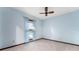 This bedroom features light blue walls, a ceiling fan, and window with light blue curtains at 109 Crestwood Dr, Longwood, FL 32779