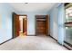 Light blue bedroom featuring wood-framed windows and a cedar-lined closet for optimal storage at 109 Crestwood Dr, Longwood, FL 32779