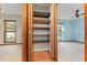 Spacious linen closet with multiple shelves; located near the bedrooms at 109 Crestwood Dr, Longwood, FL 32779