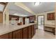 Bright kitchen featuring wood cabinetry, a breakfast bar, a skylight, and tile floors at 109 Crestwood Dr, Longwood, FL 32779