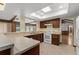 Well-lit kitchen with neutral countertops, stainless steel appliances, and wood cabinets at 109 Crestwood Dr, Longwood, FL 32779