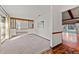 Bright, airy living room featuring neutral carpet, wood trim, and natural light at 109 Crestwood Dr, Longwood, FL 32779