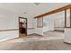 Spacious living room featuring neutral carpet and wood trim at 109 Crestwood Dr, Longwood, FL 32779