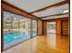 Bright living room with sliding glass doors to a private screened-in pool at 109 Crestwood Dr, Longwood, FL 32779