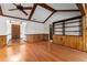 Open living room with exposed beam ceilings, hardwood floors, and natural light at 109 Crestwood Dr, Longwood, FL 32779