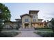 Inviting clubhouse entrance featuring well-manicured landscaping and elegant architectural details at 122 Vista Verdi Cir # 216, Lake Mary, FL 32746