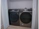 Convenient laundry area featuring side-by-side Samsung washer and dryer at 122 Vista Verdi Cir # 216, Lake Mary, FL 32746