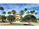 Beautiful Villanova clubhouse, surrounded by mature landscaping and palm trees at 12204 Wild Iris Way # 109, Orlando, FL 32837