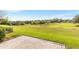 An open backyard space is ready for a new owner's vision, with easy access from a brick paver patio at 13221 Fountainbleau Dr, Clermont, FL 34711