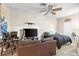 Bedroom with carpet, a ceiling fan, and a television at 13221 Fountainbleau Dr, Clermont, FL 34711