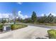 Long driveway leads to home with well-maintained landscaping and blue skies at 14031 Centerline Dr, Orlando, FL 32827