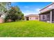 Large, green backyard with a white fence, ample space, and a screened-in porch at 14664 Spotted Sandpiper Blvd, Winter Garden, FL 34787
