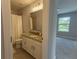 Bathroom with granite countertops connected to bedroom; bright and neutral color palette at 14664 Spotted Sandpiper Blvd, Winter Garden, FL 34787