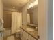 Well-lit bathroom featuring granite countertops, shower/tub combination and modern fixtures at 14664 Spotted Sandpiper Blvd, Winter Garden, FL 34787
