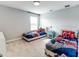 Bright bedroom featuring twin beds with superhero themed bedding, perfect for  at 14664 Spotted Sandpiper Blvd, Winter Garden, FL 34787