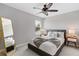 Bedroom featuring a queen size bed, ceiling fan, and carpet flooring at 14664 Spotted Sandpiper Blvd, Winter Garden, FL 34787