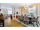 Open-concept dining area with stylish lighting, dining table, and seamless flow into the living area at 14664 Spotted Sandpiper Blvd, Winter Garden, FL 34787