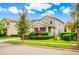 Attractive two-story home with lush landscaping, a paved driveway, and a welcoming curb appeal at 14664 Spotted Sandpiper Blvd, Winter Garden, FL 34787