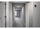 Hallway with neutral walls and carpet, illuminated by recessed lighting; clean and modern at 14664 Spotted Sandpiper Blvd, Winter Garden, FL 34787