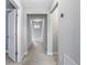 Hallway view showcasing neutral paint, recessed lighting, and easy access to other rooms in the house at 14664 Spotted Sandpiper Blvd, Winter Garden, FL 34787