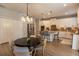 Well-lit kitchen features an island with seating and stainless steel appliances, plus a breakfast table at 14664 Spotted Sandpiper Blvd, Winter Garden, FL 34787
