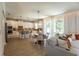 Spacious open-concept kitchen with island, stainless appliances, and living space with light-filled windows at 14664 Spotted Sandpiper Blvd, Winter Garden, FL 34787