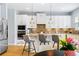 Stylish kitchen features granite countertops, stainless steel appliances, and a cozy breakfast bar at 14664 Spotted Sandpiper Blvd, Winter Garden, FL 34787