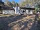 Exterior view of a single-story home with trees providing shade at 15700 Se Highway 42, Weirsdale, FL 32195