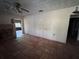 Living room showcasing ample space, tile flooring, and a charming fireplace at 15700 Se Highway 42, Weirsdale, FL 32195