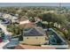 Aerial view of the house highlighting the solar panels on the roof at 1602 Pine Ridge Dr, Davenport, FL 33896