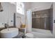 Modern bathroom featuring an oval sink, stylish fixtures, and a tiled shower and tub with a shower curtain at 1602 Pine Ridge Dr, Davenport, FL 33896