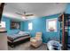 Inviting bedroom featuring a ceiling fan and natural light from the windows at 1602 Pine Ridge Dr, Davenport, FL 33896