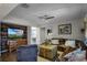 Comfortable living room with wood accent wall, plush seating, and stylish decor at 1602 Pine Ridge Dr, Davenport, FL 33896