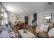 Open-concept living room with hardwood floors, a dining area, and modern design elements at 1602 Pine Ridge Dr, Davenport, FL 33896