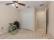 Bedroom featuring a ceiling fan, closet and fitness equipment at 195 Maple Dr, Kissimmee, FL 34759