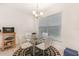 Bright dining room with a glass table and modern white chairs at 195 Maple Dr, Kissimmee, FL 34759