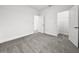 Neutral bedroom with carpet and walls ready for personalization with a doorway leading to a closet at 1988 Sunshine Peak Dr, Minneola, FL 34715