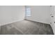 Bedroom featuring neutral carpet and a view from a window at 1988 Sunshine Peak Dr, Minneola, FL 34715