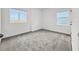 Bedroom featuring neutral carpet and bright windows at 1988 Sunshine Peak Dr, Minneola, FL 34715