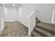 Staircase leading to carpeted living area at 1988 Sunshine Peak Dr, Minneola, FL 34715