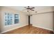 Bedroom with natural light, ceiling fan, hardwood floors, and an ensuite bathroom at 206 E South St # 4031, Orlando, FL 32801