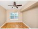 Bedroom featuring hardwood floors, a ceiling fan, and a window with bright natural light at 206 E South St # 4031, Orlando, FL 32801