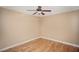 Bedroom with a ceiling fan, hardwood floors, and bright natural light at 206 E South St # 4031, Orlando, FL 32801