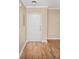 Entryway featuring hardwood floors, neutral walls and a white door at 206 E South St # 4031, Orlando, FL 32801