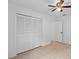 Bedroom featuring a closet and overhead fan at 211 S Deerwood Ave, Orlando, FL 32825