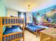 bedroom with bunkbeds and a playful ocean mural on the wall at 2182 Cooper Bell Pl, Kissimmee, FL 34747