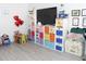 Organized playroom showcasing a large shelving unit filled with colorful storage bins at 2324 Merrimack Dr, Kissimmee, FL 34743