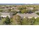 Aerial view of townhome community surrounded by mature trees and landscaping at 2851 Polvadero Ln # 107, Orlando, FL 32835